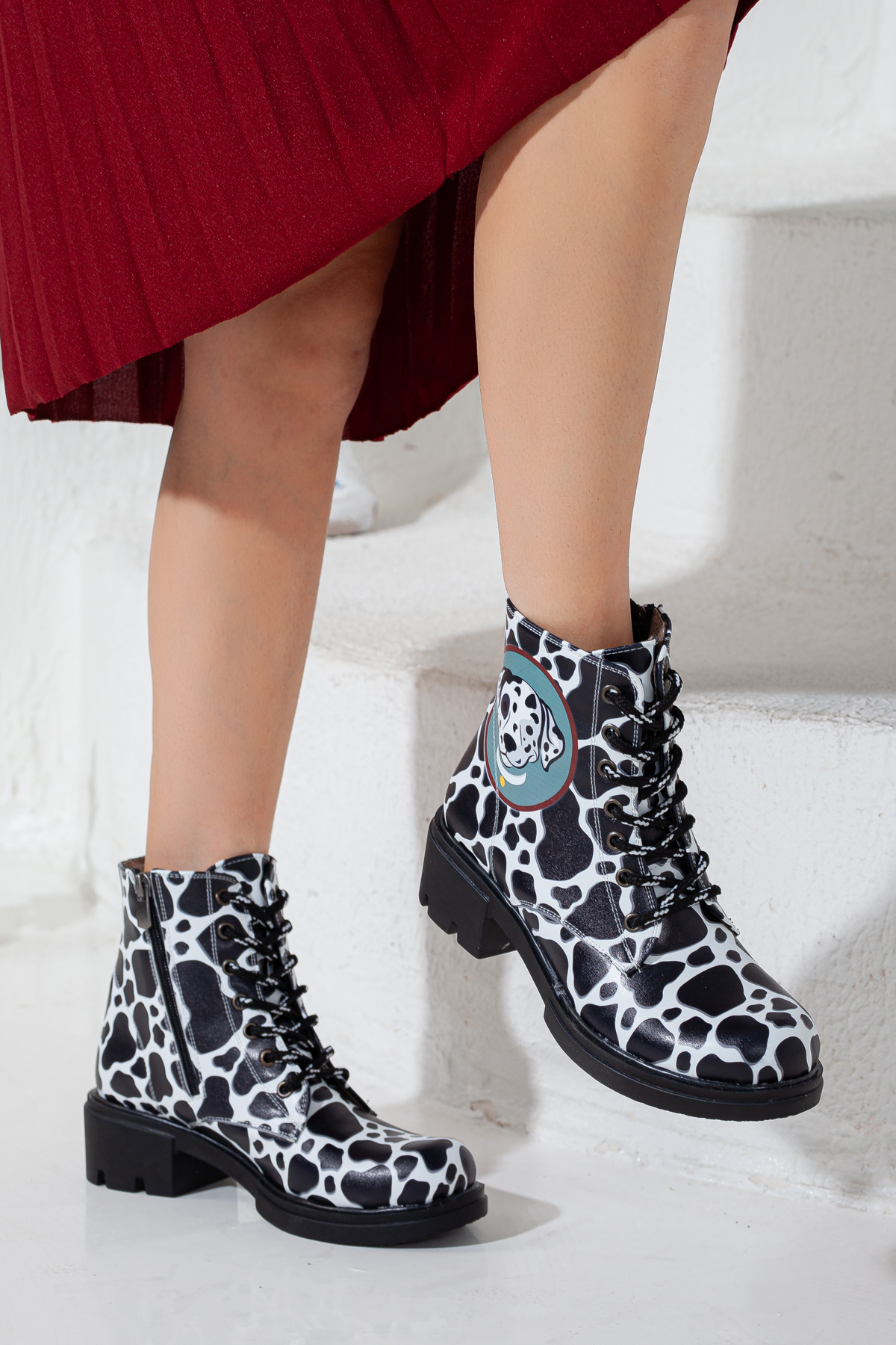Black and white dalmatian dog print boots